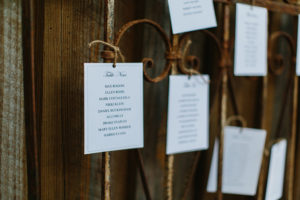 Wedding seating chart on iron bed at The Wheeler House
